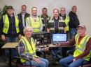 Nevada County ARES members are sworn in as Nevada County OES Disaster Service Worker Volunteers. L-R (seated) Robin De Negri, N6ZPO and Peter Mason N6ERL. L-R (standing) Cal McKitrick, AI6MC; Martin Twer, AJ6OH; Mark Triolo, N6PVI; Sean Robichaud, K6ACN; John Hart, KE6FIQ; Jeff Wagner, KK6CUG, and Jan Woldseth, KB6FMZ. Not pictured is Drew Mazer, KN6MMK. [Cal McKitrick, AI6MC, photo]